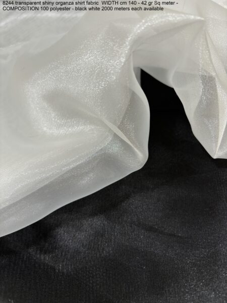 8244 transparent shiny organza shirt fabric WIDTH cm 140 - 42 gr Sq meter - COMPOSITION 100 polyester - black white 2000 meters each available